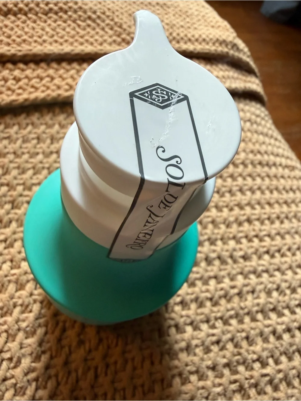 Sol de Janeiro Moisture Melting Lotion — Teal and White Bottle